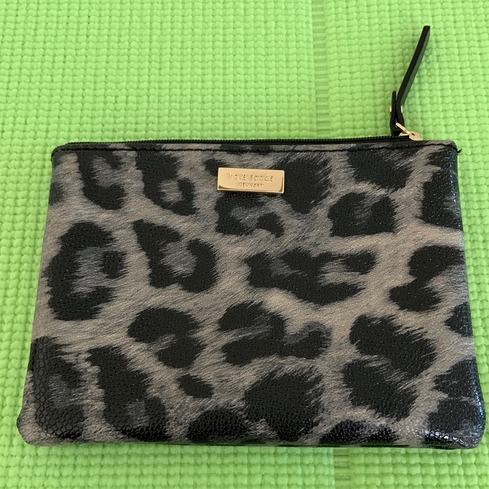 Kate Spade mini pouch with one card slot.